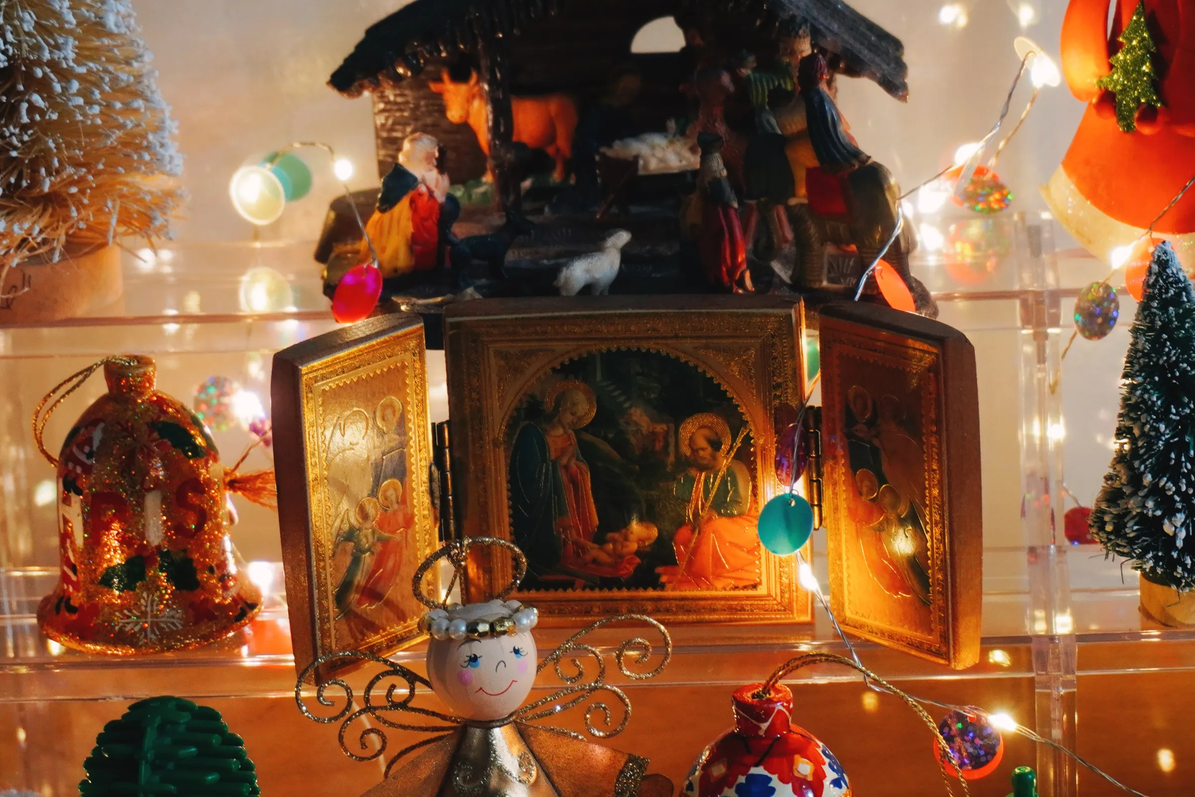 Two Belens. The one on top is old. The foldable wooden block nativity scene was a gift from our late friend, Sister Virgie. She was a very sweet soul. She would always give our family gifts like rosaries and books. We remember you, Sister Virgie!