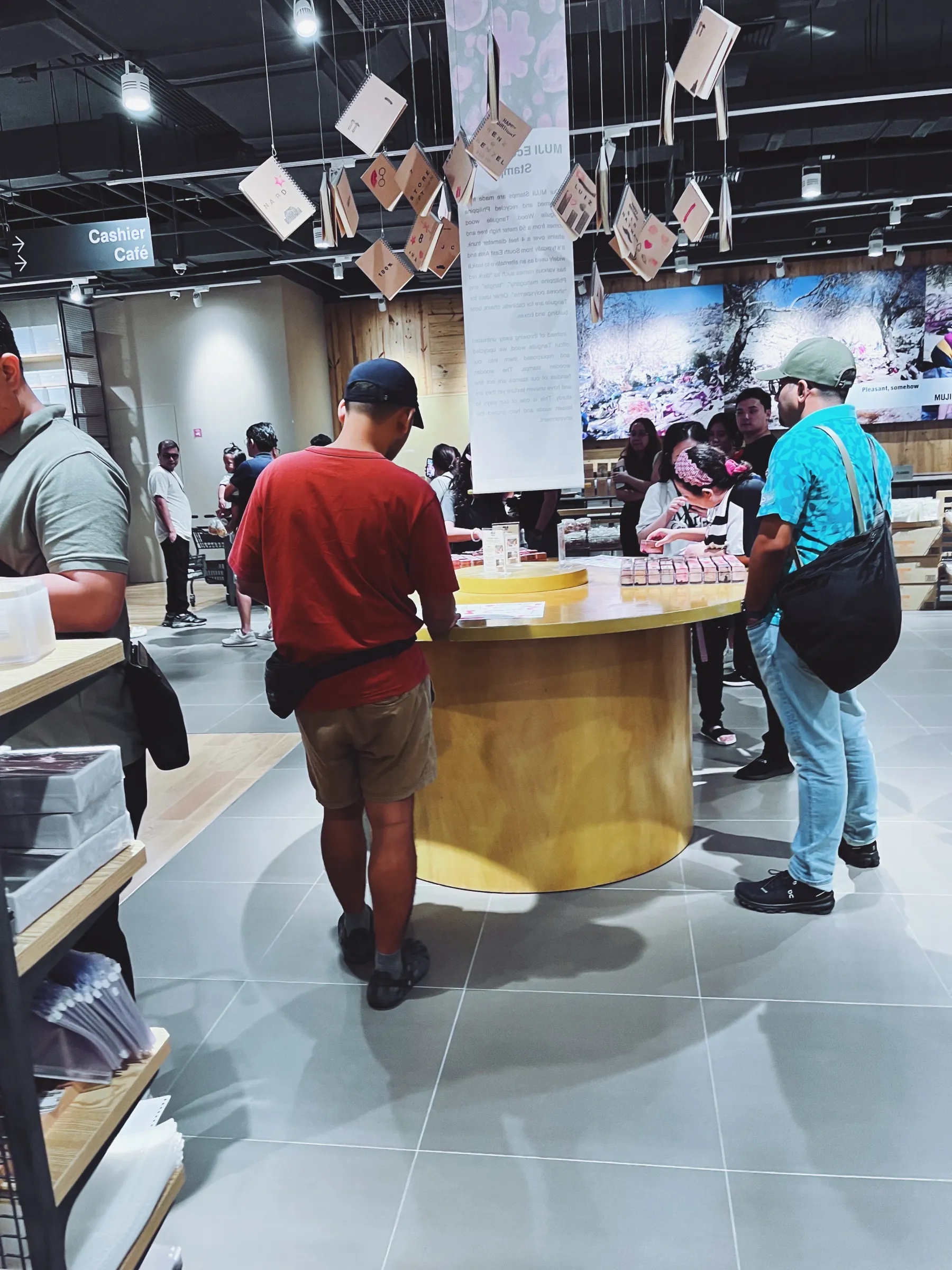 Some people started gathering at the stamp station, mostly those who were waiting for family members to finish shopping or paying at the cashier.