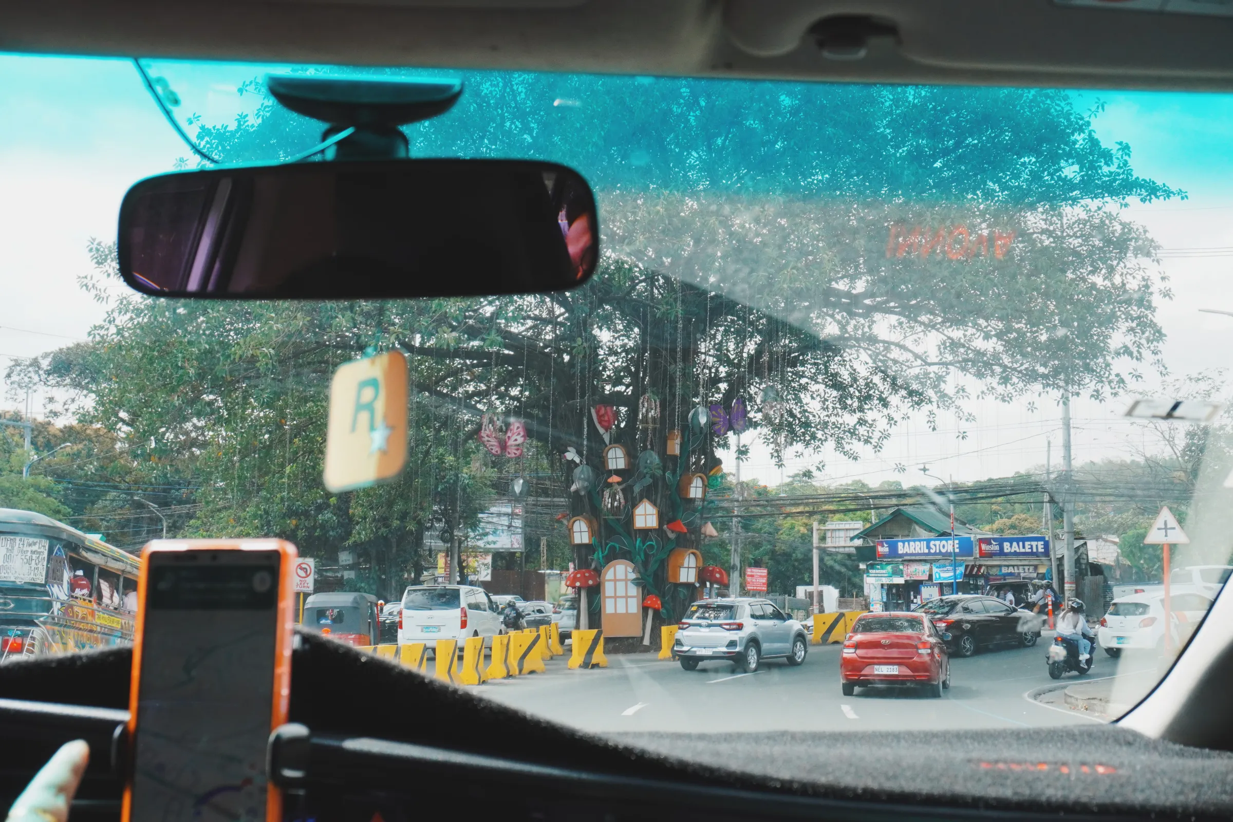 This old tree in the middle of the street now peppered with lanterns